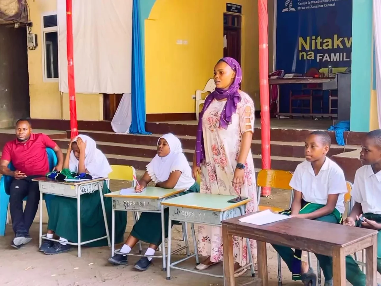 Pupils and a teacher taking part in a discussion activity