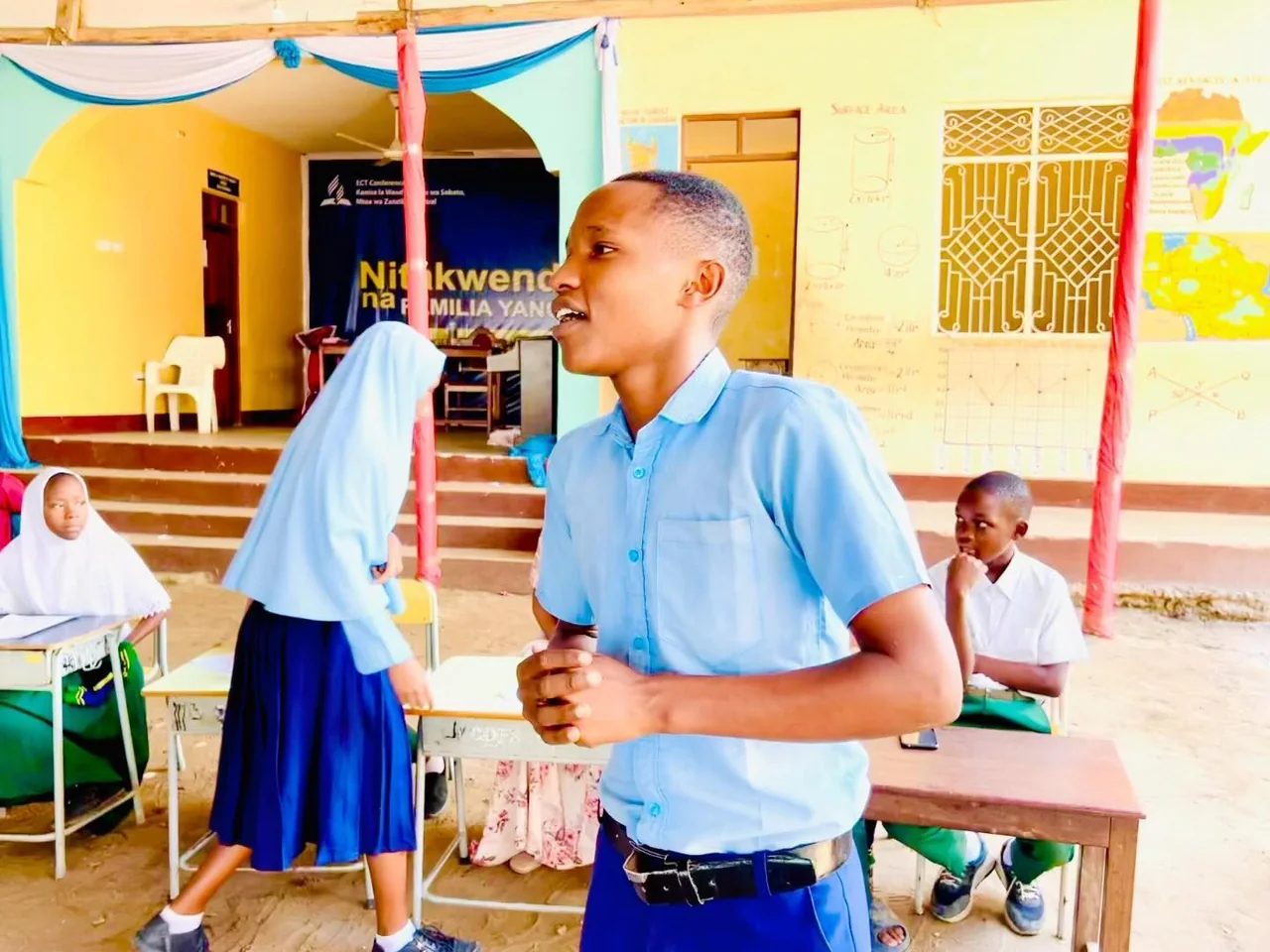 A pupil speaking confidently during a school activity